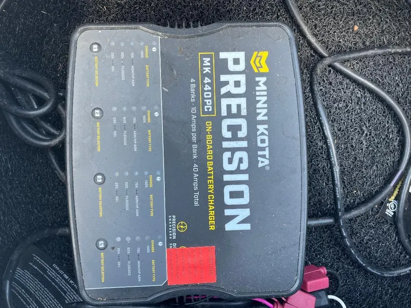 Slide: The Image of Minn Kota Precision MK 440PC onboard battery charger on Xpress X19 Pro 2022 boat. - 15