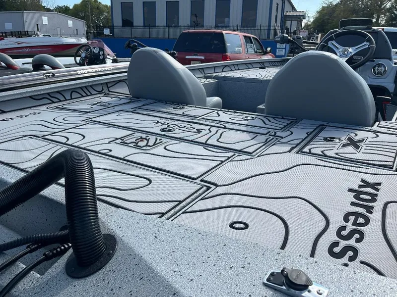 Slide: The Image of 2022 Xpress X19 Pro boat interior with detailed deck design and dual seats. - 17