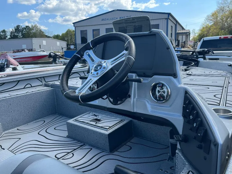 Slide: The Image of Steering console of 2022 Xpress X19 Pro boat with modern design and controls. - 19