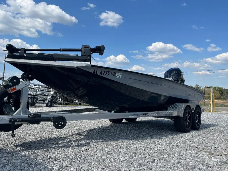 Slide: The Image of 2022 Xpress X19 Pro boat on trailer under blue sky with clouds. - 5