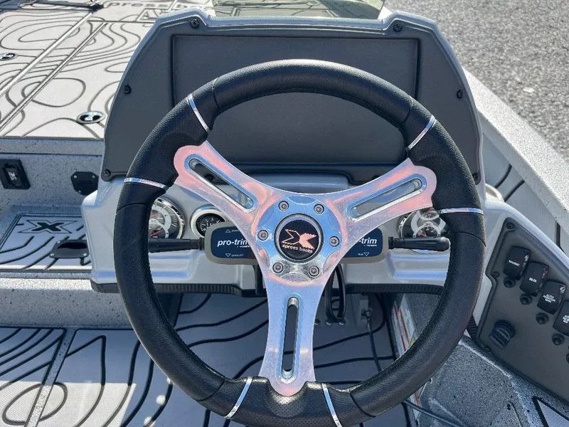 Slide: The Image of Steering wheel of 2022 Xpress X19 Pro boat, featuring sleek design and modern controls. - 8