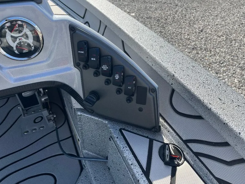 Slide: The Image of Control panel of 2022 Xpress X19 Pro boat with switches and gauges. - 9