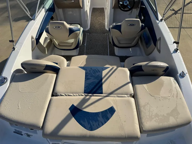 Slide: The Image of 2017 Chaparral 18 H20 Ski & Fish boat interior with beige and blue seating. - 10