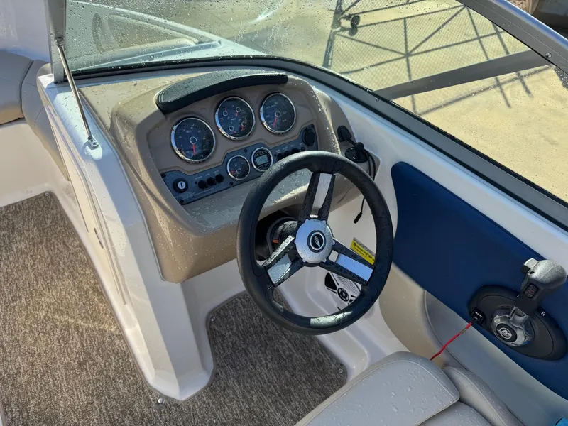Slide: The Image of 2017 Chaparral 18 H20 Ski & Fish boat dashboard with steering wheel and gauges. - 7