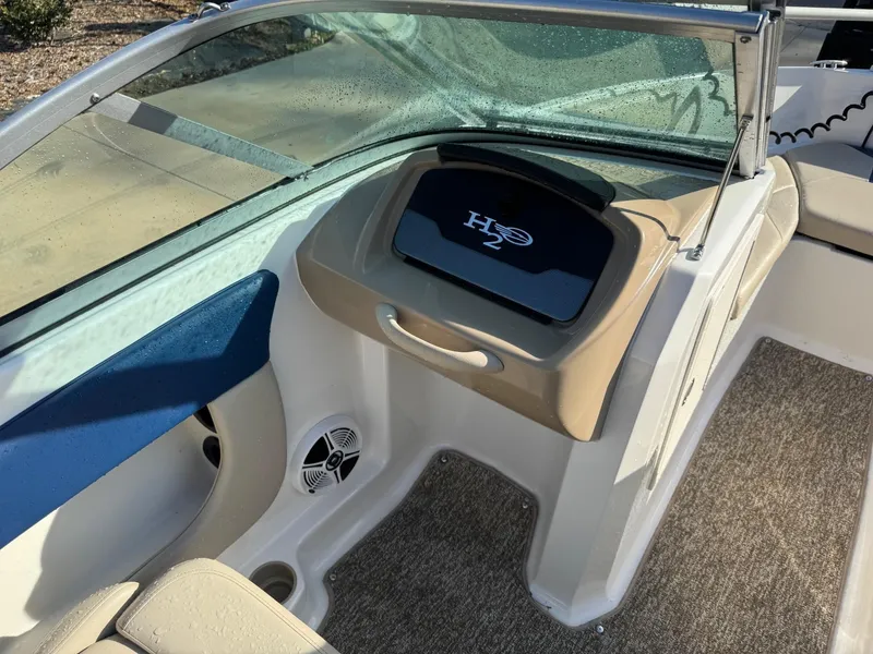 Slide: The Image of 2017 Chaparral 18 H20 Ski & Fish boat interior with H2O logo and seating area. - 8