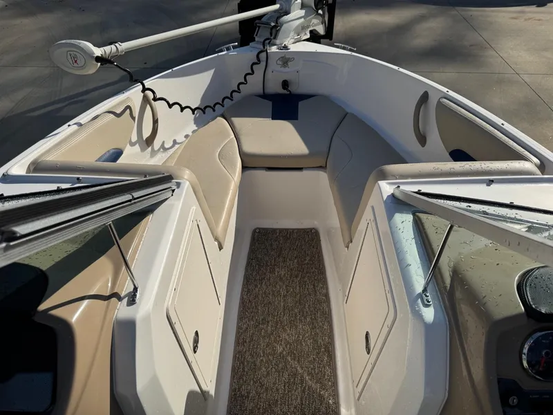 Slide: The Image of 2017 Chaparral 18 H20 Ski & Fish boat interior with seating and trolling motor. - 9