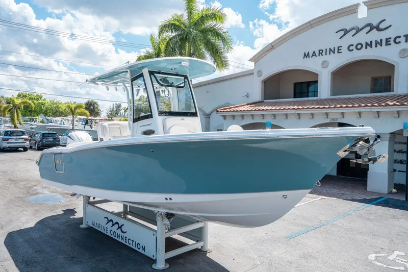 Slide: The Image of 2025 Sea Hunt Ultra 255 SE boat displayed at Marine Connection dealership. - 8
