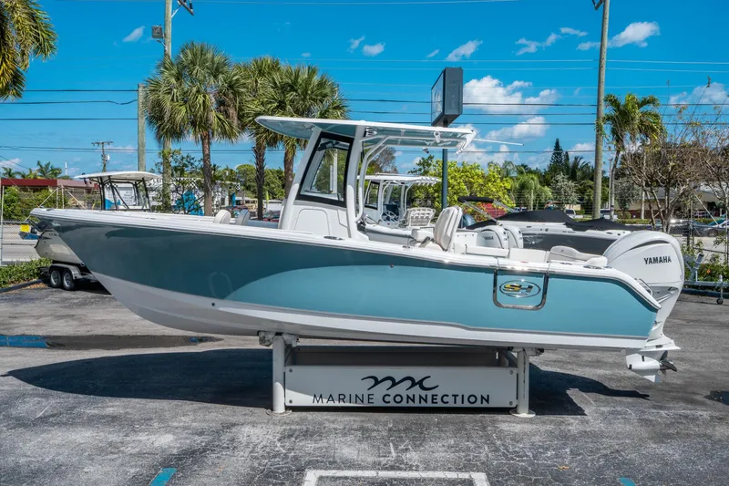 Slide: The Image of 2025 Sea Hunt Ultra 255 SE boat displayed at Marine Connection dealership. - 5