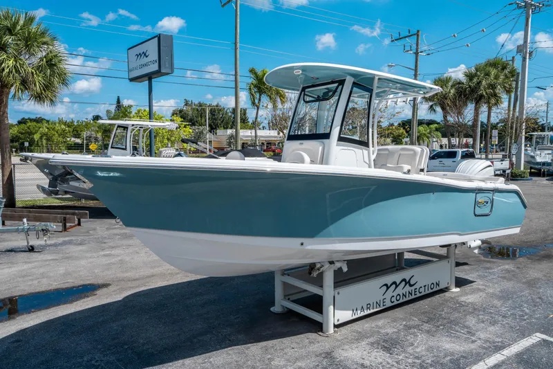 Slide: The Image of 2025 Sea Hunt Ultra 255 SE boat displayed at Marine Connection dealership. - 6