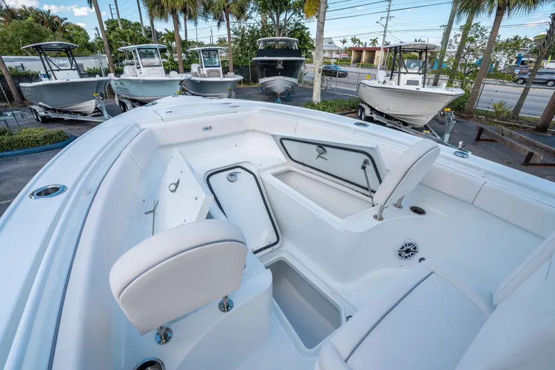 Slide: The Image of 2025 Sea Hunt Ultra 255 SE boat interior with open storage compartments. - 29
