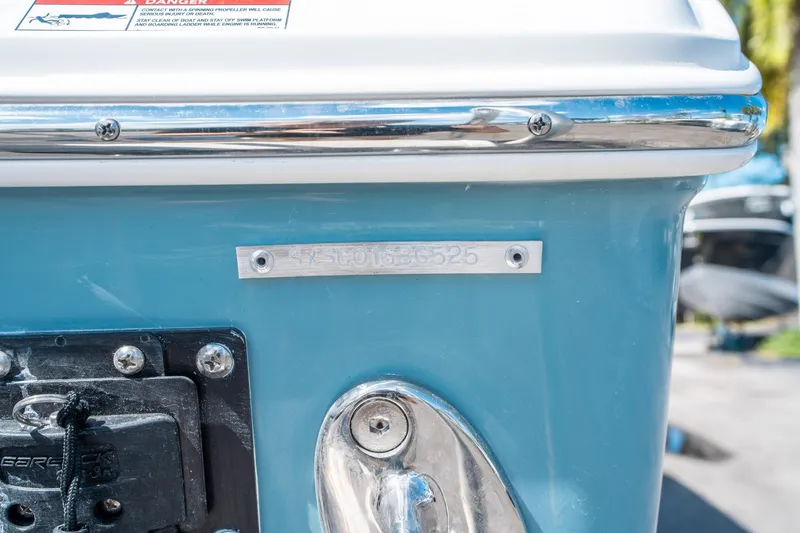 Slide: The Image of 2025 Sea Hunt Ultra 255 SE boat with identification plate and warning label. - 33