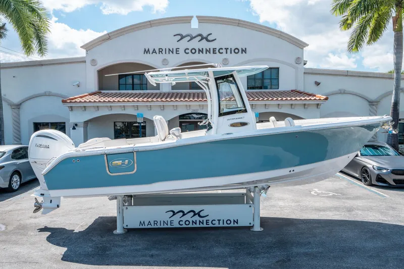 Slide: The Image of 2025 Sea Hunt Ultra 255 SE boat displayed at Marine Connection dealership. - 1