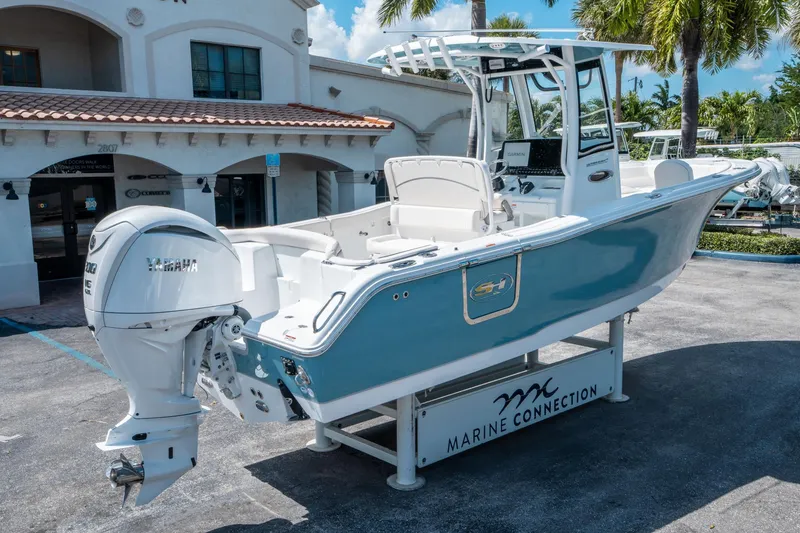 Slide: The Image of 2025 Sea Hunt Ultra 255 SE boat with Yamaha engine at Marine Connection dealership. - 2