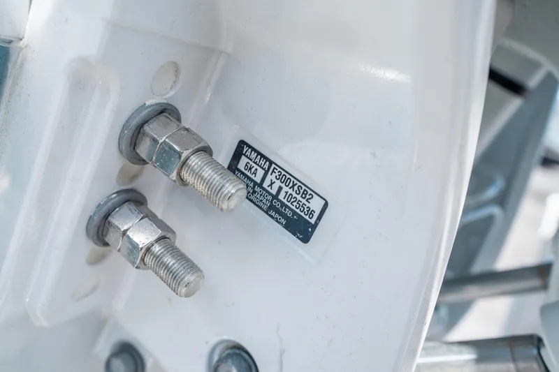 Slide: The Image of Close-up of Yamaha engine bolts on 2025 Sea Hunt Ultra 255 SE boat. - 32