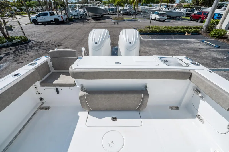 Slide: The Image of 2025 Sea Hunt Gamefish 27 FS boat interior with seating and dual engines. - 10