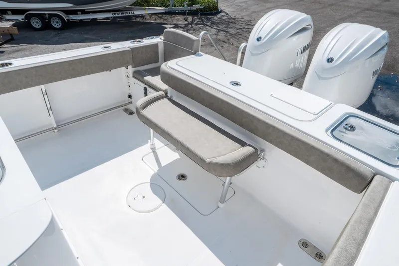 Slide: The Image of 2025 Sea Hunt Gamefish 27 FS boat interior with seating and dual Yamaha engines. - 13