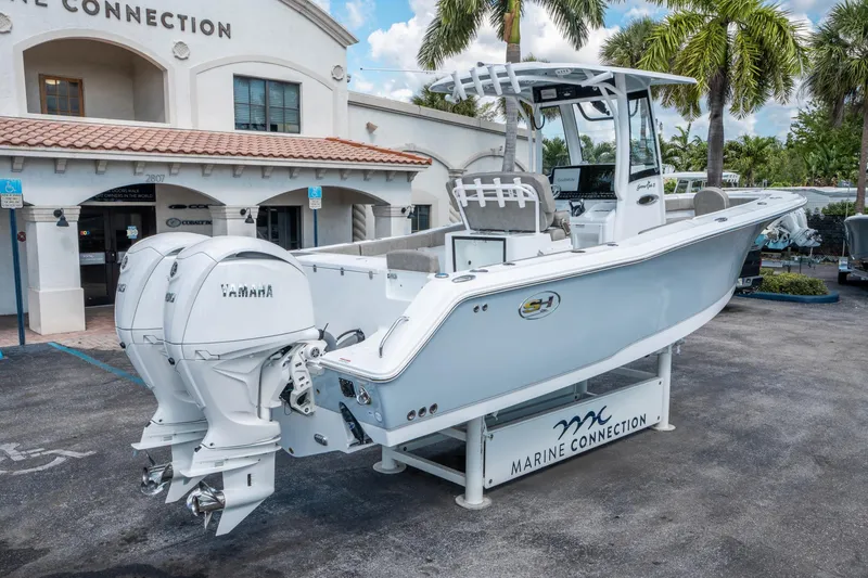Slide: The Image of 2025 Sea Hunt Gamefish 27 FS boat with Yamaha engines at Marine Connection dealership. - 2