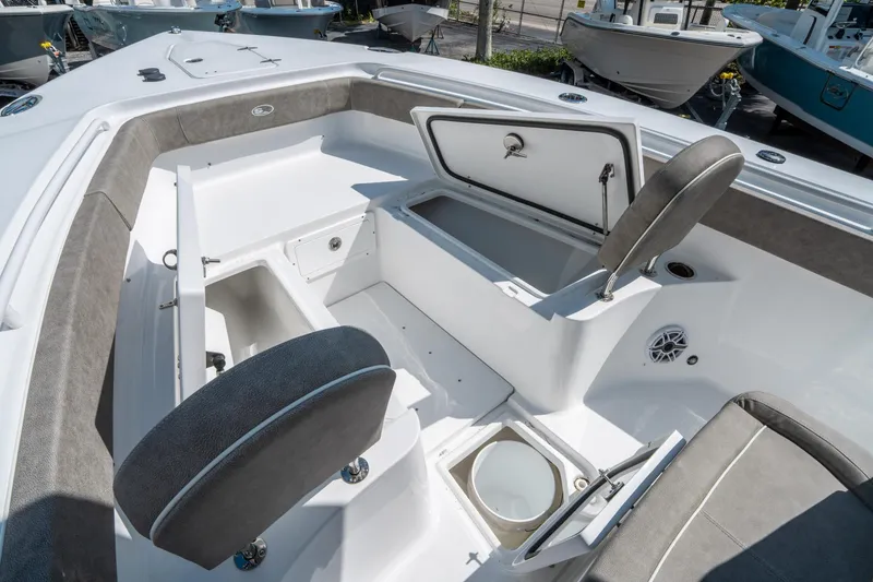 Slide: The Image of 2025 Sea Hunt Gamefish 27 FS boat interior with seating and storage compartments. - 36