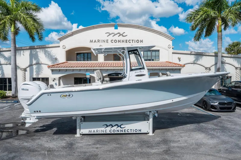 Slide: The Image of 2025 Sea Hunt Gamefish 27 FS boat displayed at Marine Connection dealership. - 1