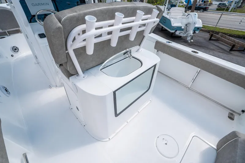 Slide: The Image of 2025 Sea Hunt Gamefish 27 FS boat interior with rod holders and seating. - 16