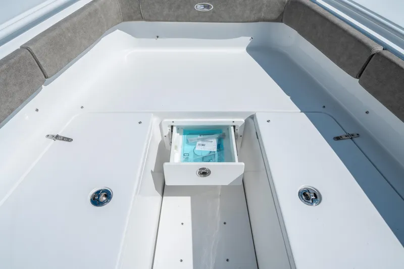 Slide: The Image of 2025 Sea Hunt Gamefish 27 FS boat interior with open storage compartment. - 37