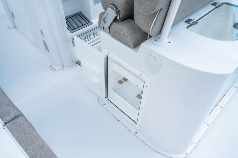 Slide: The Image of 2025 Sea Hunt Gamefish 27 FS interior with storage compartment and seating. - 24