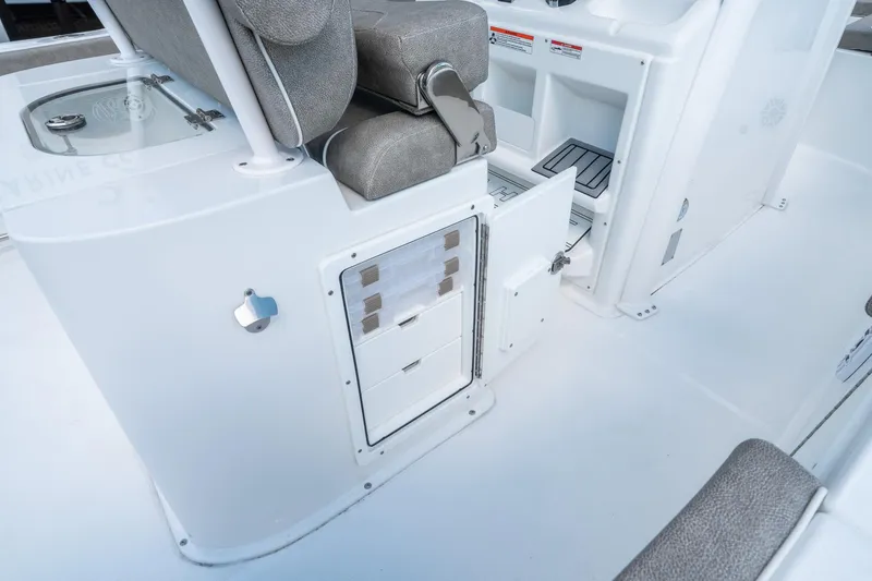 Slide: The Image of 2025 Sea Hunt Gamefish 27 FS boat interior with storage compartments and seating. - 23