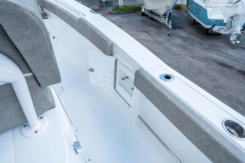 Slide: The Image of 2025 Sea Hunt Gamefish 27 FS boat interior with open storage compartment. - 25
