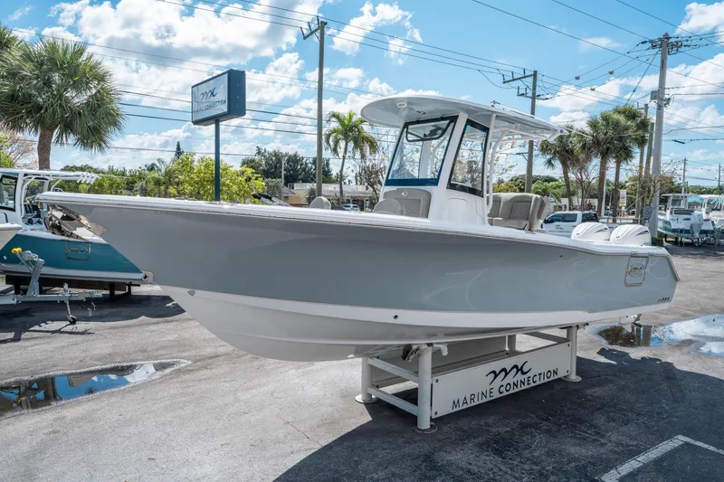 Slide: The Image of 2025 Sea Hunt Gamefish 27 FS boat displayed at Marine Connection dealership. - 6