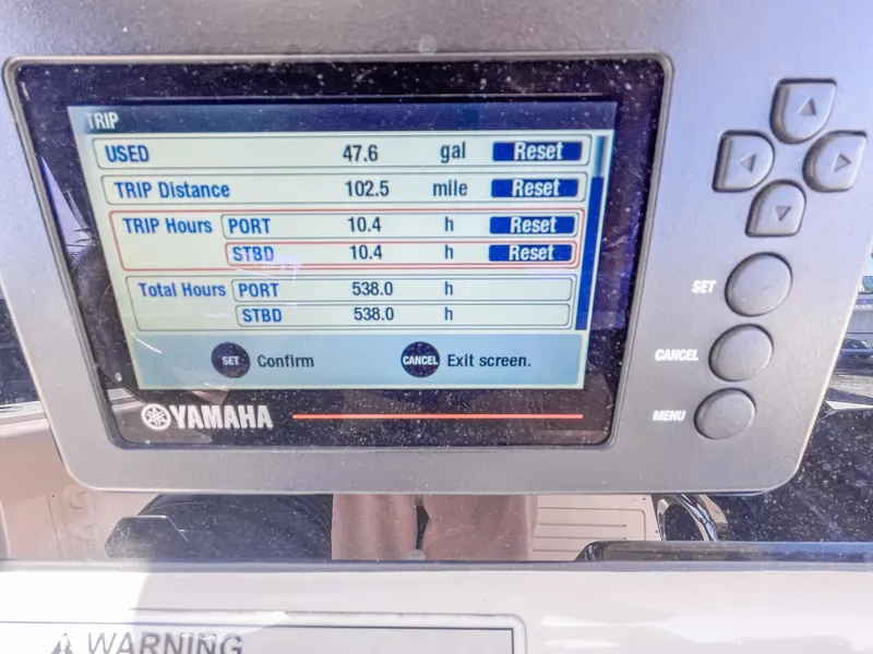 Slide: The Image of Yamaha display showing trip data on a 2016 Cobia 277 CC boat. - 15