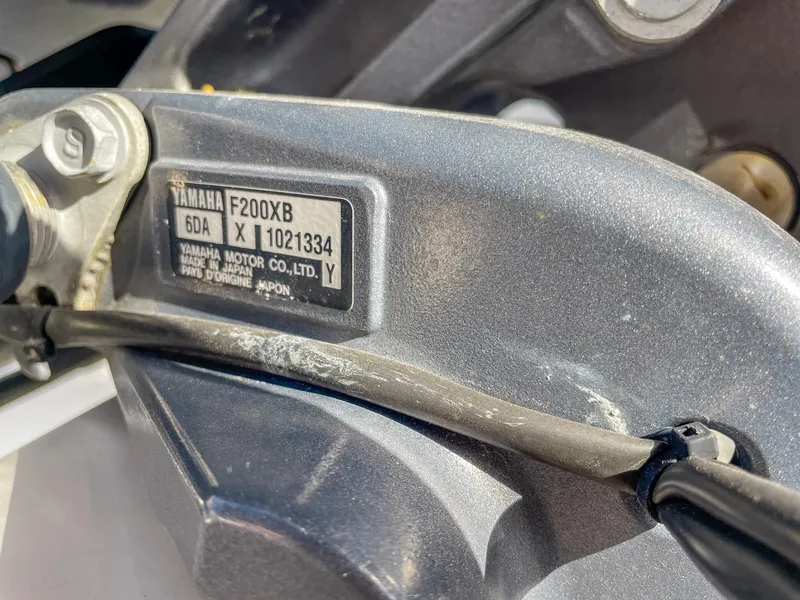 Slide: The Image of Close-up of Yamaha F200XB engine label on 2016 Cobia 277 CC boat. - 21