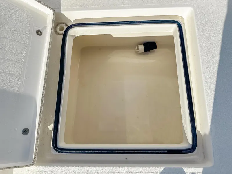 Slide: The Image of Open storage compartment on a 2017 Pathfinder 2600 TRS boat. - 12