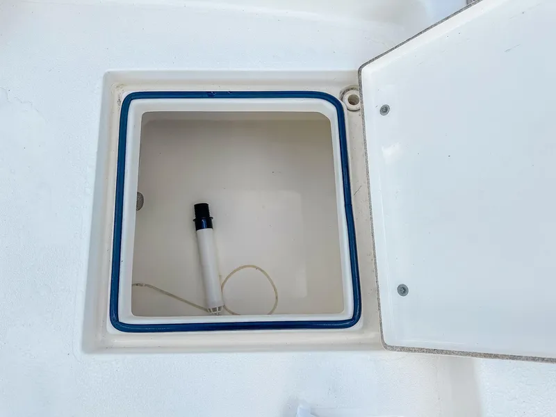 Slide: The Image of Open storage compartment on 2017 Pathfinder 2600 TRS boat with a white interior. - 13