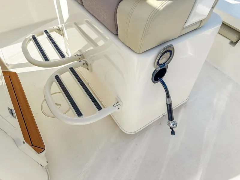Slide: The Image of 2017 Pathfinder 2600 TRS boat seating and ladder detail with hose attachment. - 16