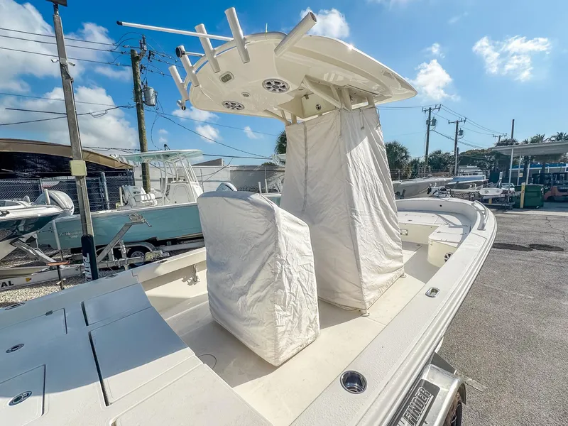 Slide: The Image of 2017 Pathfinder 2600 TRS boat with covered console and seating, parked outdoors. - 27