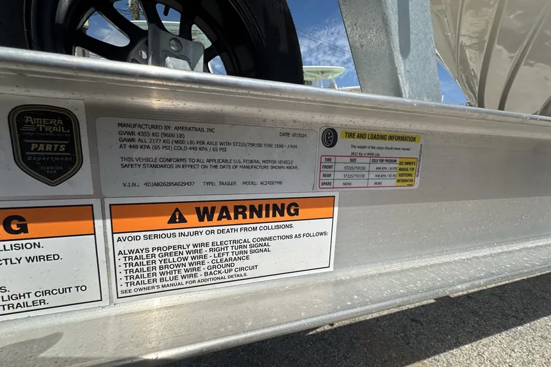 Slide: The Image of Warning labels and tire information on a 2017 Pathfinder 2600 TRS trailer. - 28