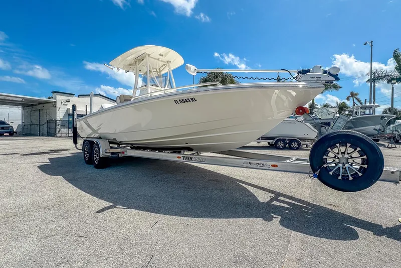 Slide: The Image of 2017 Pathfinder 2600 TRS boat on trailer under clear blue sky. - 3