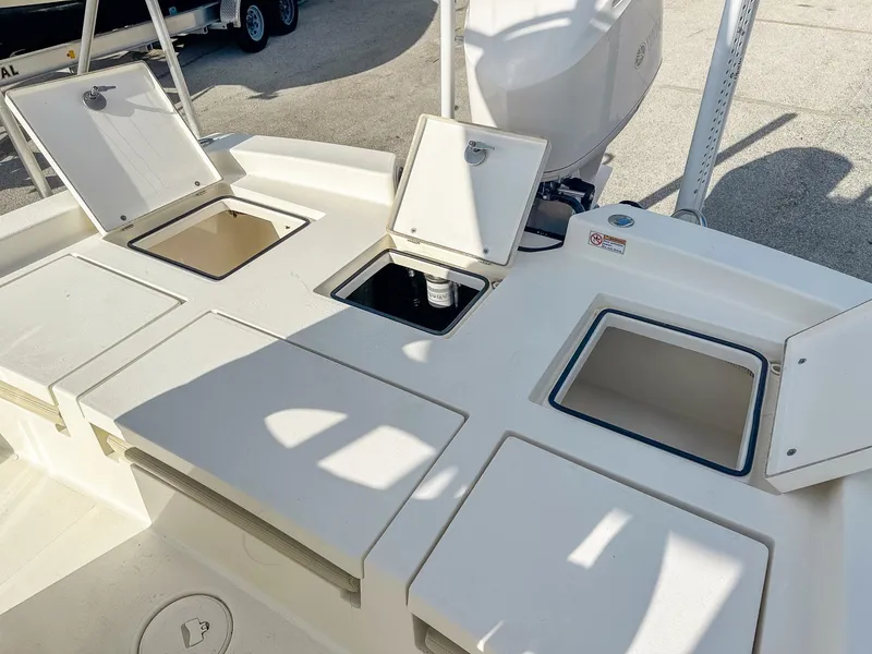 Slide: The Image of 2017 Pathfinder 2600 TRS boat with open storage compartments and Yamaha engine. - 8