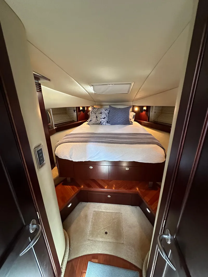 Slide: The Image of Luxurious cabin interior of 2006 Sea Ray 48 Sundancer yacht with elegant bedding. - 27