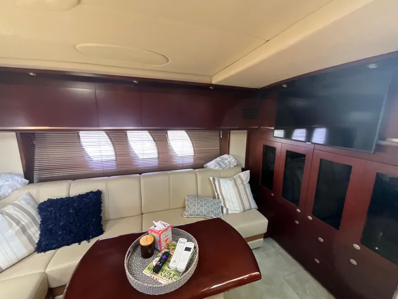 Slide: The Image of Luxurious interior of 2006 Sea Ray 48 Sundancer yacht with plush seating and modern amenities. - 28