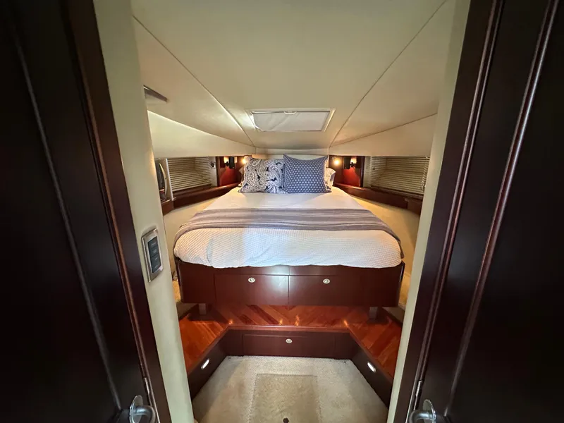 Slide: The Image of Luxurious cabin interior of 2006 Sea Ray 48 Sundancer yacht with cozy bed and elegant wood finish. - 29
