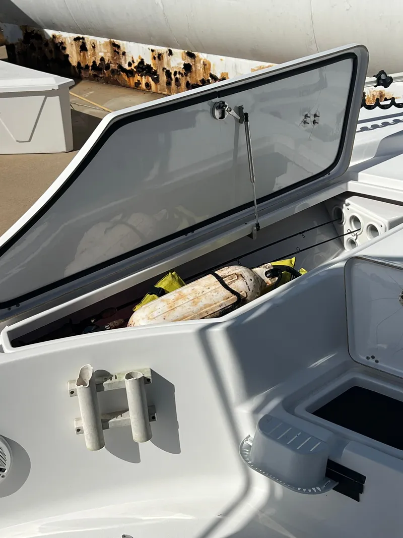 Slide: The Image of Open storage compartment on a 2014 Sportsman Masters 247 Bay Boat. - 16