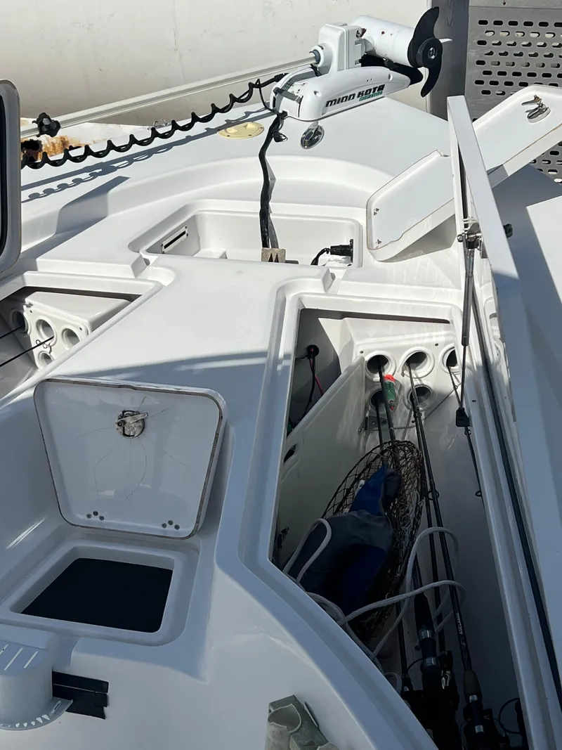 Slide: The Image of 2014 Sportsman Masters 247 Bay Boat deck with storage compartments and trolling motor. - 17