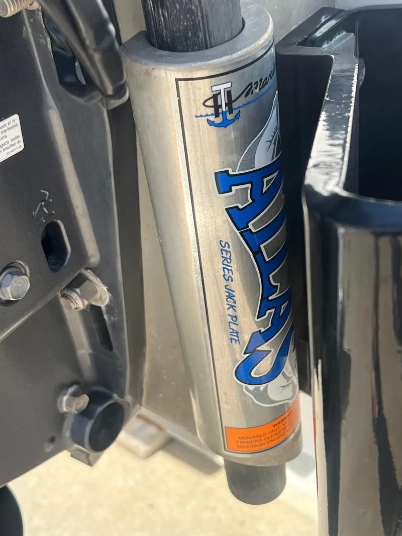 Slide: The Image of Close-up of Atlas Series hydraulic jack plate on 2014 Sportsman Masters 247 Bay Boat. - 2