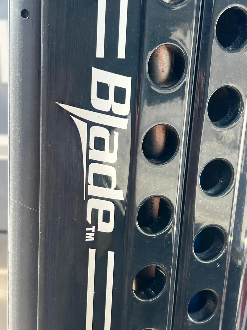 Slide: The Image of Close-up of Blade logo on 2014 Sportsman Masters 247 Bay Boat component. - 3