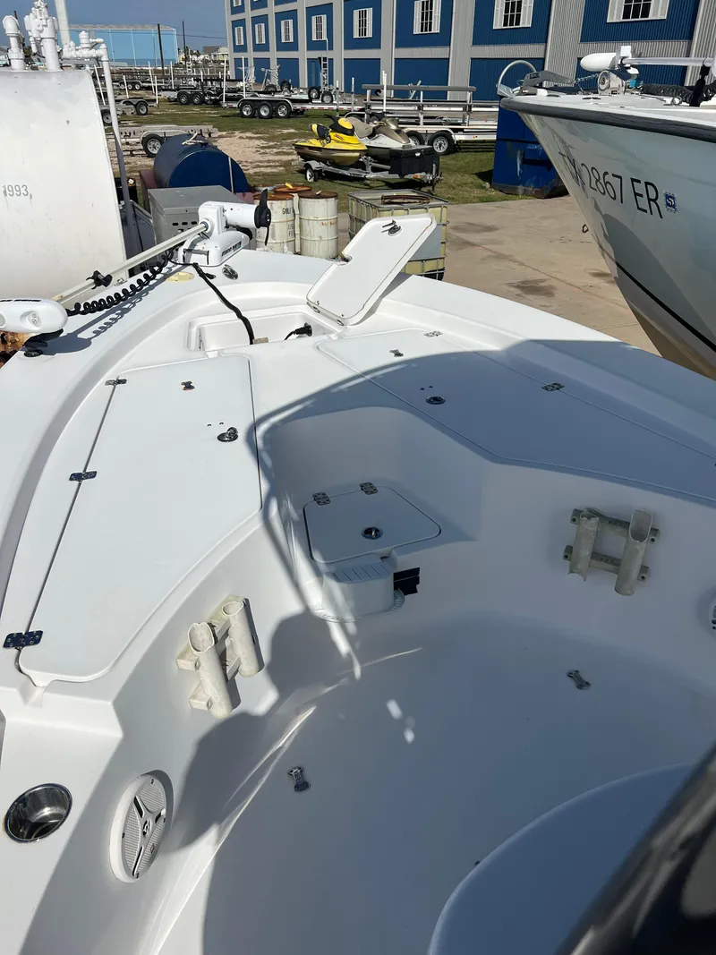 Slide: The Image of 2014 Sportsman Masters 247 Bay Boat deck with storage compartments and seating. - 31