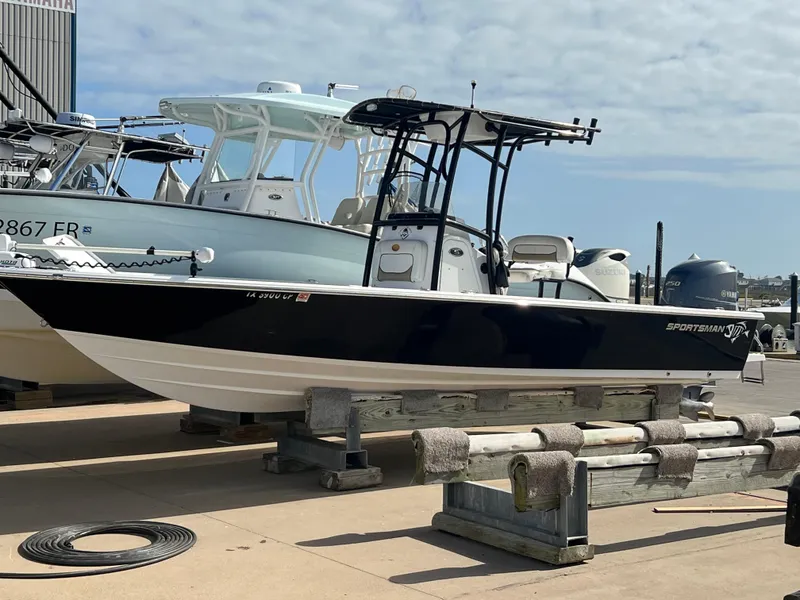 Slide: The Image of 2014 Sportsman Masters 247 Bay Boat on display at a marina. - 32