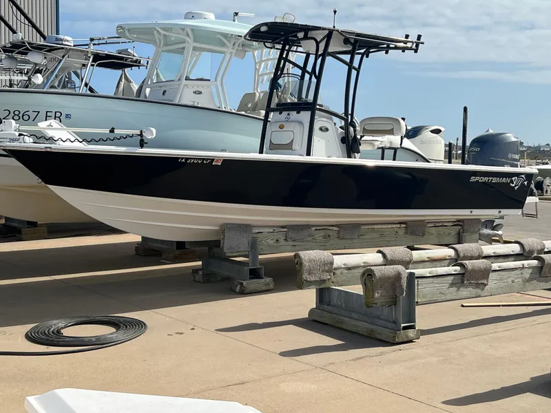 Slide: The Image of 2014 Sportsman Masters 247 Bay Boat on a dock, ready for use. - 33