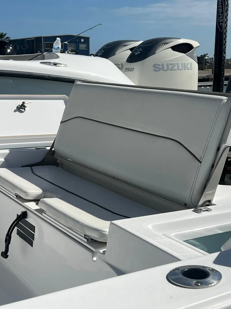Slide: The Image of 2014 Sportsman Masters 247 Bay Boat with Suzuki engines, featuring a sleek white seating area. - 4