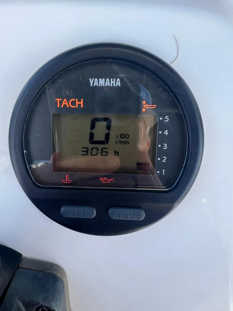 Slide: The Image of Yamaha tachometer displaying 306 hours on a 2014 Sportsman Masters 247 Bay Boat. - 8
